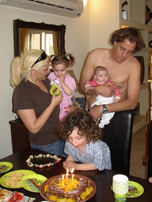 Itamar blowing out the candles