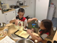 The Segolis preparing cheesecake